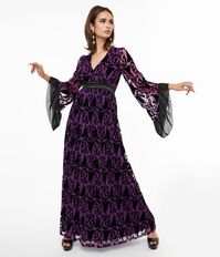 A charming maxi silhouette crafted in a smooth and lightweight purple woven fabric that dances with a black velvet burnout print of Maleficent from Sleeping Beauty. Outfitted with three-quarter length sleeves that dance with ruffled chiffon-style fabric while a back zipper nips in the empire waist.