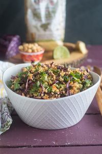 The base of this Vegan Thai Peanut Millet Salad is cooled millet, shredded red cabbage, carrots, green onions, and cilantro. The millet bulks up the salad, adding fiber, B-complex vitamins, as well as several essential amino acids. #salad #vegan #food #healthy #healthyrecipes #glutenfree