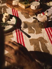 The Christmas Bow tablecloth.This piece is hand-printed by Nic Brittin and is perfect for bringing holiday cheer to your celebrations. Gather your loved ones around this festive heirloom tablecloth and create cherished memories over joyful meals and special moments. Hand printed with eco paint on 100% European linen Medium: 140cm x 260cmLarge: 140cm x 300cm Made to order with a two week lead time. Wash at 30/40 degrees and line dry