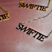 Adorn yourself with the official Swiftie Necklace - a stylish piece of jewelry that's perfect to show your admiration for Taylor Swift. Crafted from quality materials, it's lightweight, comfortable, and sure to make a statement. 🤩 Lookin' sharp and feelin' swift! Make a statement with the Swiftie Necklace – a fashionable accessory that celebrates the one and only Taylor Swift! 💛 Add a little Taylor Swift to your look with this charming Swiftie necklace! Deck yourself out in t-swizzle style and