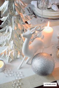 A winter white and silver holiday tablescape creates a magical, wintery scene for your Christmas and holiday entertaining inspiration.