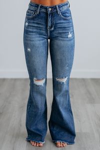 Details: Journee Risen Flare Jeans High Rise Intentional Distressing Flared Bottoms Raw Edge Frayed Hems Fading/Whiskering Great Stretch Zip Fly Button Closure Medium Wash Denim Available in Sizes 0/24-3XL Rise: 10.5" Inseam: 33.5" Leg Opening: 24" Material: 74% Cotton, 24% Polyester, and 2% Spandex We are recommending true to size for most comfort! 1XL - Sizes (16-18) 2XL - Sizes (18-20) 3XL - Sizes (20-22)