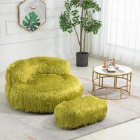 A classic bucket chair combined with the relaxed feel of a bean bag. We've added structure and style to the iconic seat, pairing the familiar beaded fill with piped seams and a supportive back – an enveloping silhouette for hours of cozy comfort.Sitting on the lazy sofa is like sitting on a cloud! Covered with skin-friendly faux fur rabbit wool, this soft and luxurious fabric is gentle and cozy against your skin. Filled with high-quality, high-density, high-resilience memory foam, this bean bag