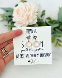 Our Rose Gold & Silver Circle Cubic Zircon earrings are part of our Bridal Party Collection! These earrings are the perfect amount of sparkle to commemorate your wedding day with your best girls by your side. You can customize these to be used as thank you gifts or a special way to ask them to be a part of your big day! Message me the names of your girls, the message you would like and the name for after the Love! You can also let me know your wedding colors and we will match the ribbon colo