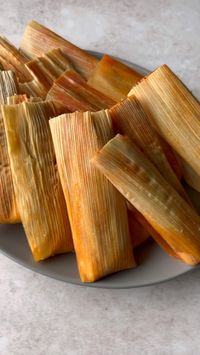 Learn how to make tamales at home with these simple step-by-step instructions. These authentic Mexican tamales are filled with a red chile pork wrapped in a fluffy masa dough.