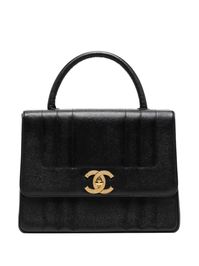 1995 Mademoiselle handbag from CHANEL Pre-Owned featuring black, caviar leather, signature interlocking CC turn-lock fastening, single circular top handle, internal zip-fastening pocket and Serial Number: 3358890 . Conscious: Purchasing this item continues its narrative and reduces the environmental impact of using new resources. You can be confident that you’re making a better choice for the Planet..