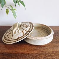 Vintage stoneware ceramic tortilla warmer / holder. Signed by artist “Praise God Rob.” 8.5” diameter x 4.5” height