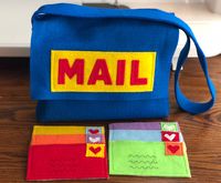 "This cute little mail set will delight your little mailman and inspire hours of imaginative play. This mail set is also a great way for kids to learn their colors! Your mail set includes the following: 1 MAIL bag, either blue or red. Scroll through the photos for examples of the red and blue bags. Mail bag size is 8\" high by 10\" wide. Strap is 28\" long. 6 \"letters\", one each of red, orange, yellow, green, blue, purple. Letters are 3\" x 5\" and are double layered and firmly sewn. Please us