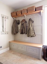 Bespoke boot room with various storage solutions with coat hooks, storage boxes, cupboards and lead hooks. Perfect for the family.