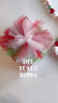 Tulle bows! These are so simple and pack a major punch. Is my camera shaking the whole time? Yep. Did I film off center (accidentally)? Also yes. 😬. Anywho, here are some instructions:  • If you have a small or skinny present one roll of tulle from the Dollar Tree will cover one present. Or you can buy these big holiday rolls at Hobby Lobby to last several seasons for $5.  • -start by tying a knot around your present and make sure you have loose tails (this is how you’re going to secure your tulle bow)  • -you want to roughly measure the width of your present (I just use my hand), and start looping tulle in that width around your hand. You’ll want 8-10 loops, and more loops the bigger the gift. I did 10 here.   • -put your bunch of tulle on the present and secure it with the tails from