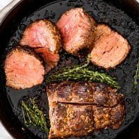 This whole roasted melt-in-your-mouth Beef Tenderloin is such a classic once-a-year-celebratory dish! Beautifully cooked medium-rare beef from edge to center with a perfectly browned and flavorful crust! #beef #tenderloin