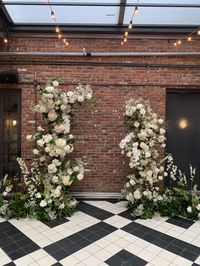 Whites and greens, wild and lush ceremony arrangements.