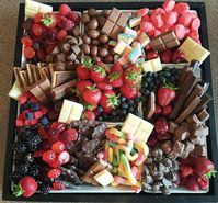 Berries and Sweets party tray. Chocolate, candy, and fresh berries.