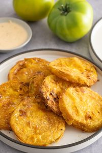 These Air Fryer Fried Green Tomatoes are the perfect Southern appetizer or side dish you can easily make at home. They have a flavorful coating outside and tangy inside, making these air-fried green tomatoes a perfect addition to any meal.