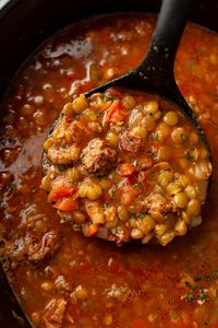 This Crockpot Italian sausage and lentil soup recipe with bacon is an ultra hearty and comforting meal for cooler weather! It's warm and nourishing and simple to make.