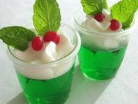 Mistletoe Jello Shots - Beneath each mistletoe garnish you'll find a kiss of apple pucker and a hint of mint. The mistletoe experience captured in a cup : )