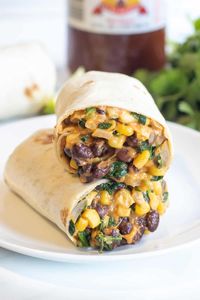 Lunch or dinner in a hurry, and healthy, too! Our 15 Minute Black Bean and Spinach Burritos are one of our go-to quick, easy, well rounded, and delicious meals. Everything you love about a black bean, cheesy vegetarian burrito, plus some added greens!