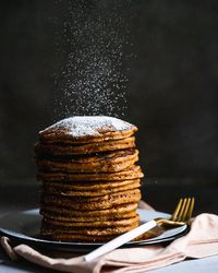 These gingerbread pancakes are full of cozy spices and molasses: and since they're oatmeal pancakes, they've got a healthy spin! #pancakes #gingerbread #holiday #glutenfree #breakfast #christmas #healthy #recipe