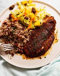 Jamaican Jerk Fish on a plate with Jamaican Slaw and Coconut Rice & Beans