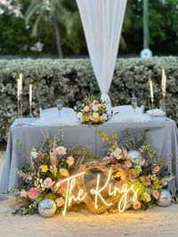 Personalize your sweetheart table with a neon sign at the Dolphin Point Villa Resort in Key Largo with Best. Day. Ever. Wedding Planning in the Florida Keys