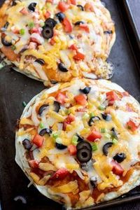 Make this Copycat Taco Bell Mexican Pizza Recipe to cure your fast food craving. Homemade Mexican Pizza is quick and easy to make for a fun dinner idea. #copycatrecipes #restaurantrecipes #fastfoodrecipes #tacobellrecipes #mexicanrecipes #dinnerrecipes #mexicanpizza