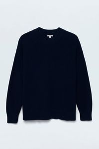 Mockneck long sleeve sweater with wide ribbed cuffs and collar. Crafted from a marled, waffle knit with directional knitting and dropped shoulders for a relaxed fit and transitional wearability. Navy is a deep midnight blue with tonal stitching and ribbing.