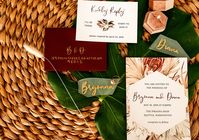 Tropical floral boho wedding invitation suite with custom calligraphy! Paired here with maroon RSVP envelopes with gold ink! Perfect for your boho wedding by the beach!