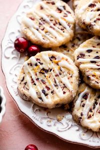 These slice-and-bake style cranberry orange icebox cookies deliver big flavor from surprisingly simple ingredients. They're filled with chewy dried cranberries and fragrant orange zest. Drizzle on an easy 2-ingredient orange glaze for the finishing touch. Recipe on sallysbakingaddiction.com