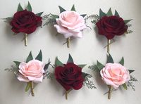 💐Burgundy, white, blush rose boutonnière with greenery accents. Choose your ribbon color! Please leave me a message in the checkout notes of which color you'd like. 💐I can customize your order! Message me with the items you'd like and I will be happy to create your flowers. Matching Bouquet: https://etsy.me/2QLdUEE Thank you and Congratulations!