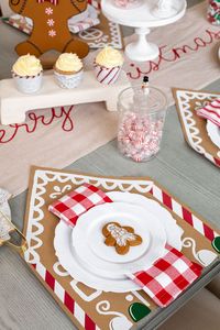 Set of 12 paper gingerbread house placemats comes with set of 12 paper napkins.