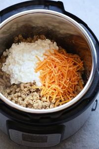 In just 5 minutes you can have a cheesy, protein-packed dinner ready to go! Make this Protein Instant Pot Mac and Cheese for the ultimate kitchen hack you'll ever do. This Protein Mac and Cheese made in the Instant Pot is made with 100% whole grain noodles, cottage cheese, and a little Greek yogurt for extra creaminess.