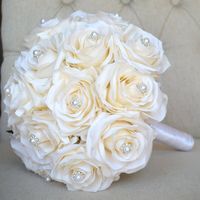 "CHAMPAGNE BRIDAL BOUQUET MADE OF PREMIUM Real Touch Silk Roses. This dreamy & breath taking Bridal Bouquet is made from approximately 20 premium real touch silk roses.  This classy bouquet is perfect for any wedding theme.   Bouquet is a mix of premium hand picked PEACH  silk real touch roses. Embellished within the roses you can add rhinestone gems or bling pearl gems to add a little bling to your special day.. This beautifully mixed bouquet is wrapped with satin ribbon down the stem and a rhi