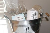 DIY Monogrammed Gift- i did the wine glasses last year.. but did the full three letter monogram... they come out cute.. and you can get pretty decent thick wine glasses from the dollar store!