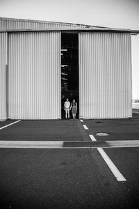 Engagement shoot in airplane hanger