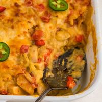 King Ranch Chicken Casserole with Rotel is the perfect weeknight meal! Layers of chicken, cheese and tortillas. It's a great meal and will soon be part of your weekly mealtime rotation! 