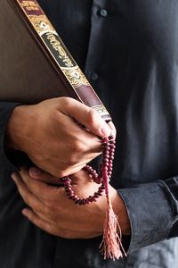 Person holding rosary and religious book | Free Photo #Freepik #freephoto #belief #rosary #faith #religion