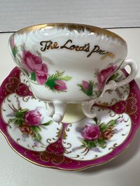 Vintage teacup and saucer "The Lords Prayer" purple flowers and gold made in China.