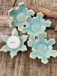 A beautiful addition to your holiday decorations. These ice blue snowflakes are a perfect display for small candles or tea lights. Alternatively, it would make a unique jewelry holder or a small spoon holder. Measurements: 3"