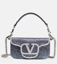 Find VALENTINO Locò Small Embellished Shoulder Bag on Editorialist. Top handle, Detachable shoulder strap. Closure: magnetic-tab fastening. Designer color name: Crys Lillac/Silver/Ameth/Crys. Made in Italy. Comes with a box. Internal details: suede lining. Material: lamb leather.