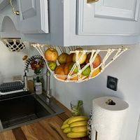 Home Kitchen Fruit Hanging Basket Wind Cotton Rope Hand-woven Vegetable And Fruit Net Pocket Describe: Lace Fruit : The lace is handmade from 100% cotton rope. We handcrafted the lace in a modern boho style with holes less than 2 inches apart so the fruit doesn't fall out. It is sturdy and durable to protect your fruit from falling. SAVE KITCHEN SPACE: You can save space by installing a lace under cabinets or shelves, it provides extra storage space and is easy to store products to keep your kit