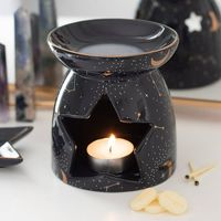 This purple constellation oil warmer measures 4.5" High, 4.25" Wide and 4.25" Deep approximately. It weighs about 1.25 pounds.  This purple constellation oil warmer is made of ceramic porcelain, glazed in high heat for optimum shiny look. Candle and Essential Oil NOT included.  This essential oil burner uses tea light candle to heat up aroma oil. Simply put a few drops of essential oil into the top dish and light a small tealight candle inside the star shaped cavity. Please do not leave lit cand