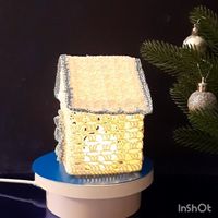 PDF Pattern Crochet. A house with a candle.  The height is 4.33 inches.  It is a three-dimensional toy for Christmas decor.