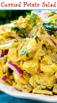 Creamy Curried Potato Salad with red onion and cilantro.