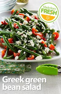 Fresh, crisp green beans, juicy tomatoes, and tangy feta cheese go Greek in this zesty salad that's packed with flavor and color. It's a treat for the mouth and the eyes!