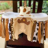 *Please check turn around times. All items are made to order* Our fabric garland is so adorable to use as a picture prop for babies first birthday or used as a high chair banner. Made with tan, brown, and cow print fabrics and #1 cowboy banner.