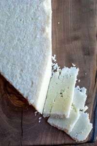 Cotija cheese is that crumbly cheese that graces so many of our favorite Mexican dishes. It's salty, tangy flavor adds punch to everything from refried beans to elote. Let's take a look at this delicious Mexican cheese, plus 20 ways to devour it! #cotija #cotijacheese #holajalapeno #mexicancheese