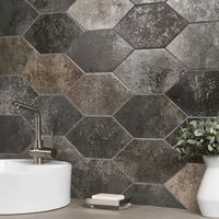 About The Tile: Simple and unique, the Adorno Hexagon Magma are eye-catching and boldly dark. With a high variation between tiles, a modern and slick charcoal black shade, and a semi-polished finish, this encaustic look tile offers an artisan flair made to make a statement, with a modern design that nods to the past. Key Features Made in Spain. Matte, Charcoal Black Porcelain Tile. 7x13" Hexagon Encaustic Cement Tile. Made For Residential & Commercial Wall | Floor Use. Great For Kitchen, Backspl