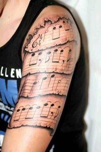 Discover music tattoos for men, expressing passion for music and showcasing instruments, notes, and lyrics.