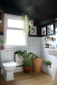 I don’t know if you’ll be able to make as many changes as her-but this blogger that I follow has a similar seeming bathroom and made it really cute with contrast and a LOT of plants!