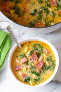 A rustic soup with bold flavor and chunky texture. This slightly creamy version is so enticing, you'll want to make it again and again! #aspicyperspective #foodblog #foodie #instayum #hungry #thekitchn #onmytable #dailyfoodfeed #foodlove #foodpic #instafood #foodstagram #tasty #portuguesekalesoup #caldoverde #caldoverderecipe #kalesouprecipe #portuguese #portugal #soup #portuguesefood #potatosoup #dinner